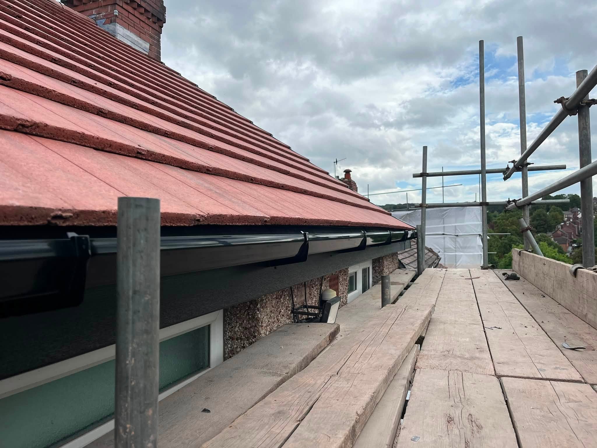 New tiled roof, fascias and guttering